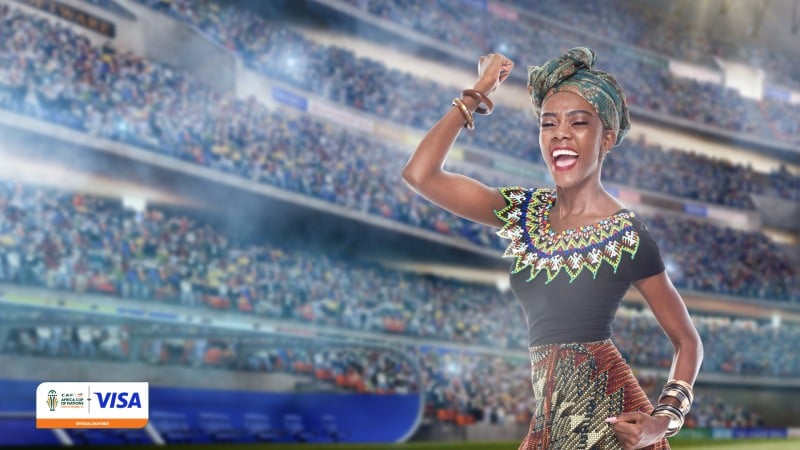A woman at a football stadium - AFCON 2023 Visa