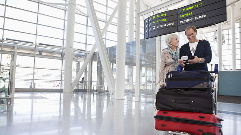 Senior couple with luggage at airport Senior couple with luggage at airport